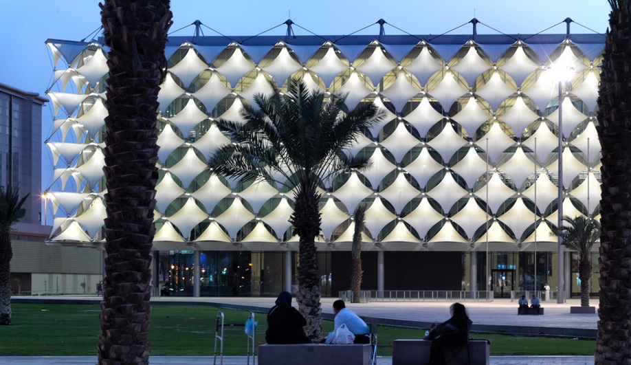 King Fahad National Library, in Riyadh, Saudi Arabia, was designed by Gerber Architekten International. The new building's cuboid shape, shielded by sun shades, wraps the old 1980s librarby on all sides.