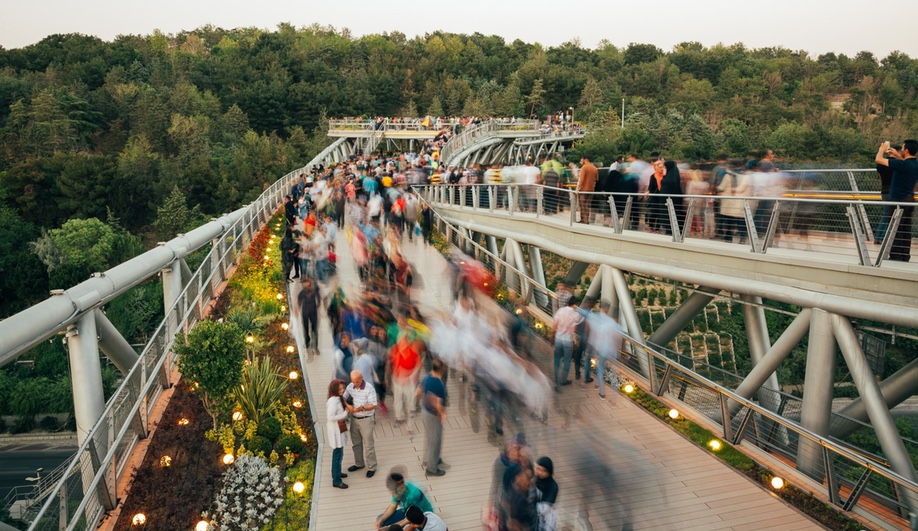 Tabiat Pedestrian Bridge, in Tehran, was designed by Diba Tensile Architecture / Leila Araghian, Alireza Behzadi. The three-level bridge, completed in 2014, connects two parks and is a popular gathering spot for locals.
